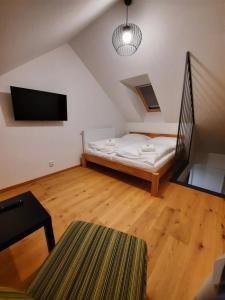 Postel nebo postele na pokoji v ubytování Apartmány Resort Na Horské