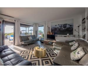 a living room with a couch and a table at Puerto Chico I and J in Playa Blanca