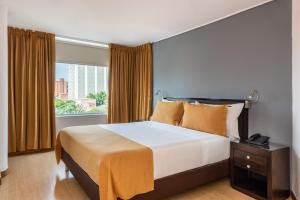 Postel nebo postele na pokoji v ubytování Hotel Egina Medellin
