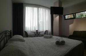 Postelja oz. postelje v sobi nastanitve Boutique Hotel Sleep and Wine
