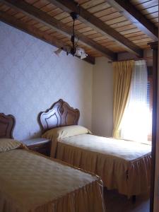 Postel nebo postele na pokoji v ubytování Casa Rural Carmina