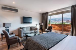 Postel nebo postele na pokoji v ubytování Hotel Egina Medellin