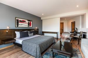 Postel nebo postele na pokoji v ubytování Hotel Egina Medellin