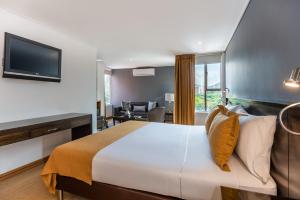 Postel nebo postele na pokoji v ubytování Hotel Egina Medellin