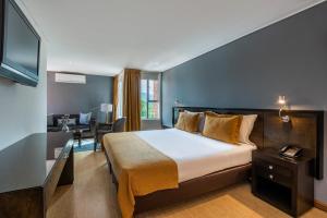 Postel nebo postele na pokoji v ubytování Hotel Egina Medellin + 37 fotografií