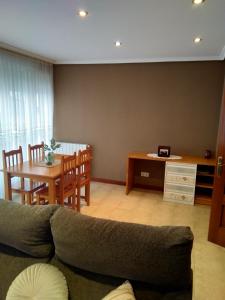 a living room with a couch and a table at Apartamento Maria in Santoña