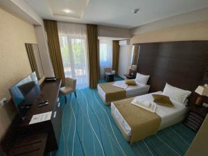 TV a/nebo společenská místnost v ubytování Hotel Nevada