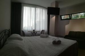 Postelja oz. postelje v sobi nastanitve Boutique Hotel Sleep and Wine