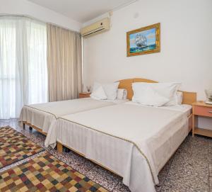 Postel nebo postele na pokoji v ubytování Hotel Raluca