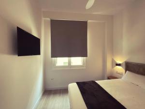 Posteľ alebo postele v izbe v ubytovaní Town Hall Suite