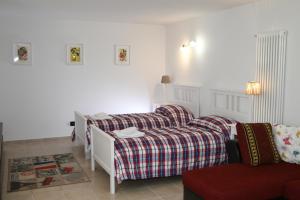 Postel nebo postele na pokoji v ubytování Apartment Gli Ulivi 4 - Tremezzina