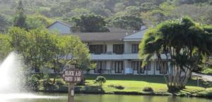 a large house with a sign in front of a fountain at Eden wilds J124 in Port Edward