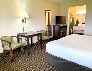 Ένα ή περισσότερα κρεβάτια σε δωμάτιο στο Roadstar Hotel Zephyrhills