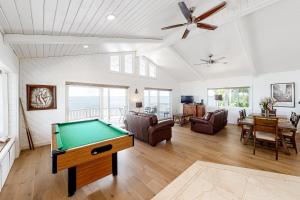 a living room with a pool table in it at Hawkins Lookout in Cudjoe Key
