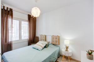 A bed or beds in a room at Santa Barbara 27 Canyelles Roses - Immo Barneda