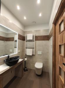 Et badeværelse på 3 Äpfel Design Apartments
