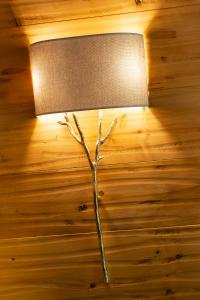 a lamp that is on top of a wooden table at Gran Baita Hotel & Wellness in Courmayeur
