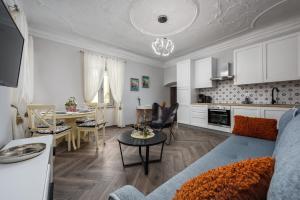 a living room with a kitchen and a dining room at Premium Apartment Daka in Poreč