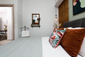 En eller flere senge i et værelse på Iliana & Sarra Apartment 2