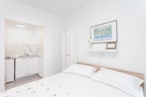 Posteľ alebo postele v izbe v ubytovaní Makarska sea view rooms