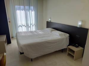 Posteľ alebo postele v izbe v ubytovaní AUTO PARK Hotel