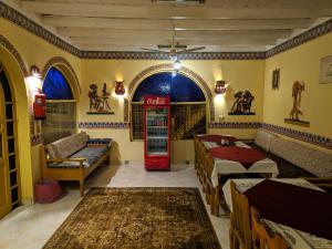a room with a red coke machine in a room at Elphardous Hotel in Luxor