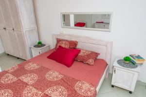 Postel nebo postele na pokoji v ubytování Apartmani LIRA