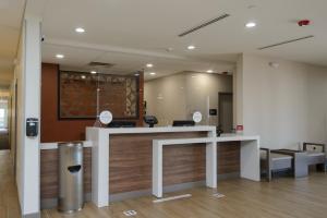 a lobby with a reception desk in a building at Candlewood Suites - Corpus Christi - Portland, an IHG Hotel in Portland