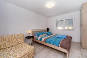 Postel nebo postele na pokoji v ubytování Apartmani LIRA