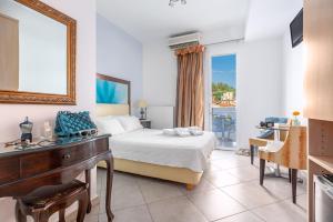 Postel nebo postele na pokoji v ubytování Hotel Lido Thassos