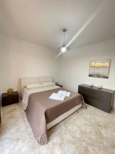 Ein Bett oder Betten in einem Zimmer der Unterkunft Vista Mozzafiato