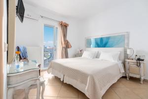 Postel nebo postele na pokoji v ubytování Hotel Lido Thassos