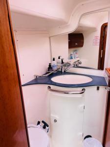 a bathroom with two sinks and a toilet at Segelyacht Bremen City in Bremen