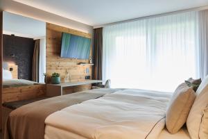 Katil atau katil-katil dalam bilik di Matthiol Boutique Hotel