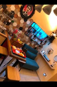 an overhead view of a living room with a blue couch at Donna Margherita Appartamento in Naples