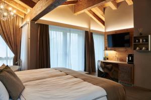 Katil atau katil-katil dalam bilik di Matthiol Boutique Hotel