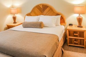 Voodi või voodid majutusasutuse Berkshire on the Ocean by VRI Resort toas