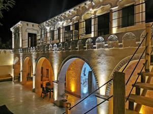 an external view of a building at night at Falcon Cave Suites in Goreme