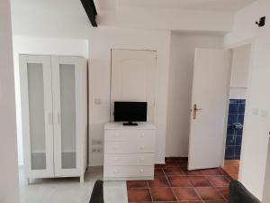TV a/nebo společenská místnost v ubytování Casa Maria