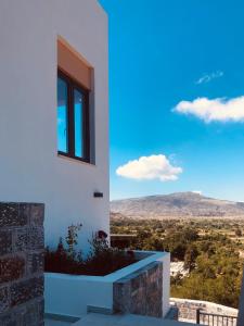 a house with a view of the mountains at Dictamus Homes in Magoulás