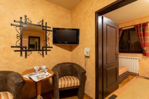 TV a/nebo společenská místnost v ubytování Guest House Vila Bajka