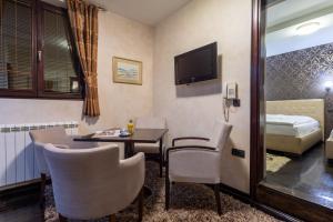 TV a/nebo společenská místnost v ubytování Guest House Vila Bajka