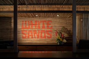 a window with a sign that reads nothing equals at White Sands Hotel in Honolulu