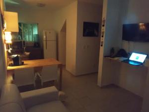 TV a/nebo společenská místnost v ubytování PARAÍSO DE MARACAJAÚ - BEIRA MAR