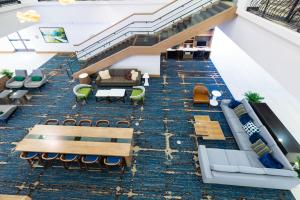 an overhead view of a lobby with couches and tables at Holiday Inn San Jose-Silicon Valley, an IHG Hotel in San Jose