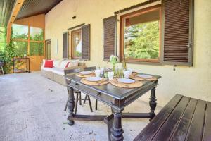 a table with plates on it in a patio at Payerbach Apartments in Payerbach