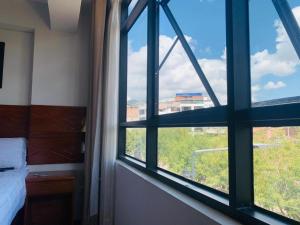 Ένα ή περισσότερα κρεβάτια σε δωμάτιο στο Hotel Daylu