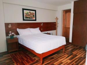 Ένα ή περισσότερα κρεβάτια σε δωμάτιο στο Hotel Daylu