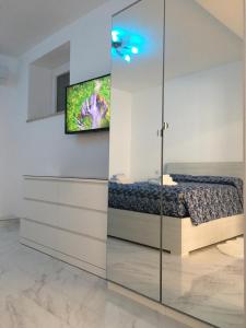 A television and/or entertainment centre at The Cove 1.3km from beach