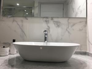A bathroom at The Cove 1.3km from beach